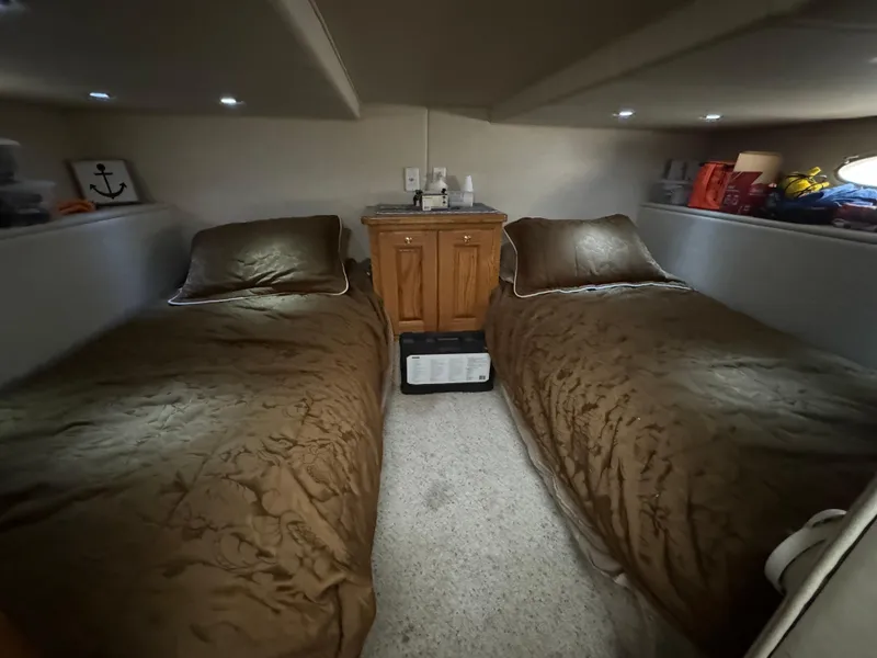 Slide: The Image of Interior of 2008 Holiday Mansion 37 with twin beds and wooden cabinet. - 27