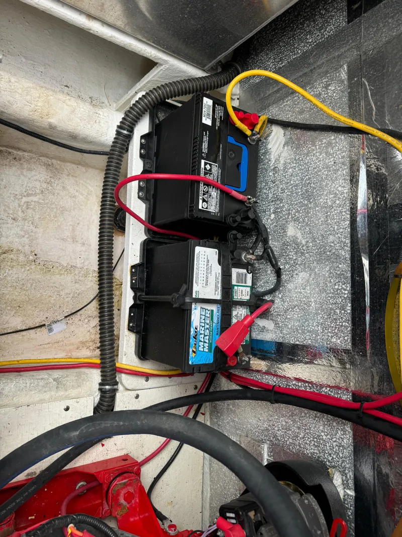 Slide: The Image of Battery setup in a 2008 Holiday Mansion 37 boat with connected cables. - 31