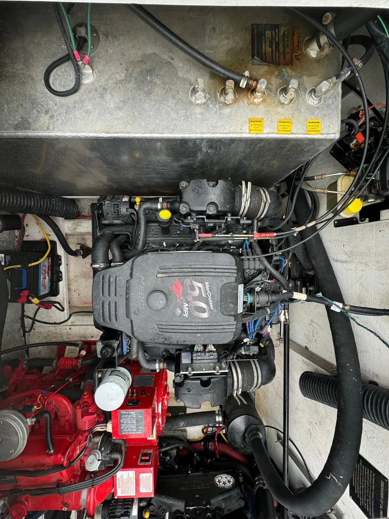 Slide: The Image of Engine compartment of a 2008 Holiday Mansion 37 boat, showcasing mechanical components and wiring. - 39