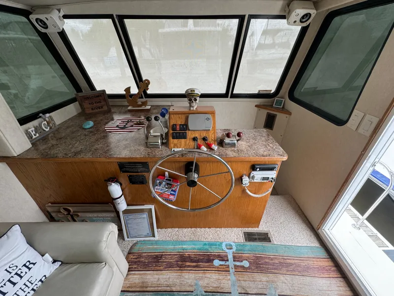 Slide: The Image of Interior helm of 2008 Holiday Mansion 37 houseboat with steering wheel and controls. - 4