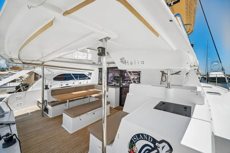 Slide: The Image of 2014 Fountaine Pajot Helia 44 catamaran with spacious outdoor seating area. - 15
