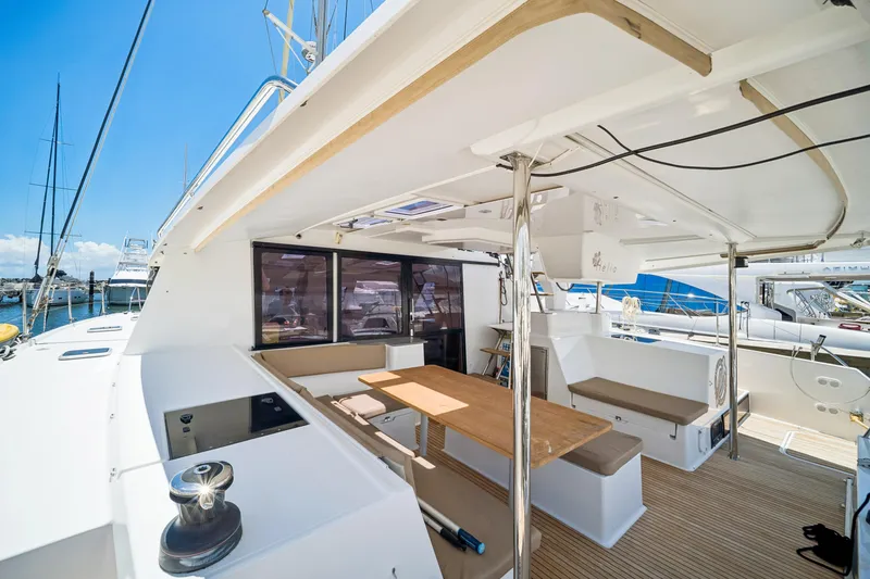 Slide: The Image of Spacious deck of 2014 Fountaine Pajot Helia 44 catamaran with seating and table. - 16