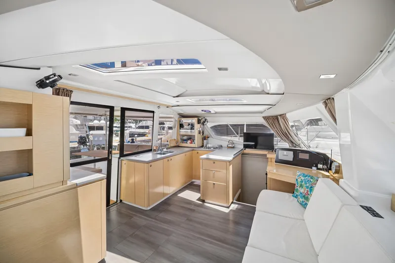Slide: The Image of Luxurious interior of 2014 Fountaine Pajot Helia 44 catamaran with modern kitchen and seating area. - 19