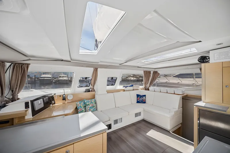 Slide: The Image of Interior of 2014 Fountaine Pajot Helia 44 catamaran with modern seating and panoramic windows. - 20