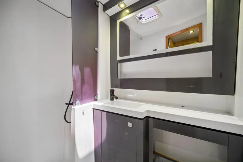 Slide: The Image of Modern bathroom interior on 2014 Fountaine Pajot Helia 44 catamaran, featuring sleek design elements. - 28