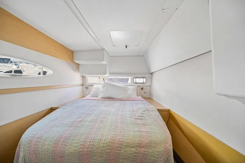 Slide: The Image of Cozy cabin interior of 2014 Fountaine Pajot Helia 44 catamaran with bed and porthole view. - 33