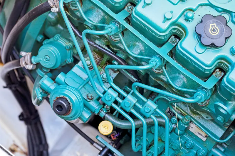 Slide: The Image of Close-up of a 2014 Fountaine Pajot Helia 44 engine, showcasing intricate components. - 42