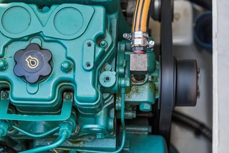 Slide: The Image of Close-up of a 2014 Fountaine Pajot Helia 44 engine component with hose and clamp. - 43