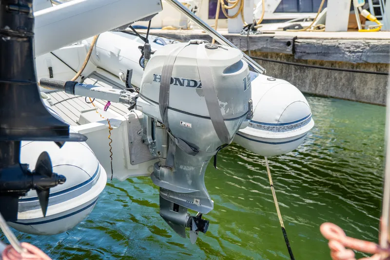 Slide: The Image of Honda outboard motor on a 2014 Fountaine Pajot Helia 44 catamaran at dock. - 47