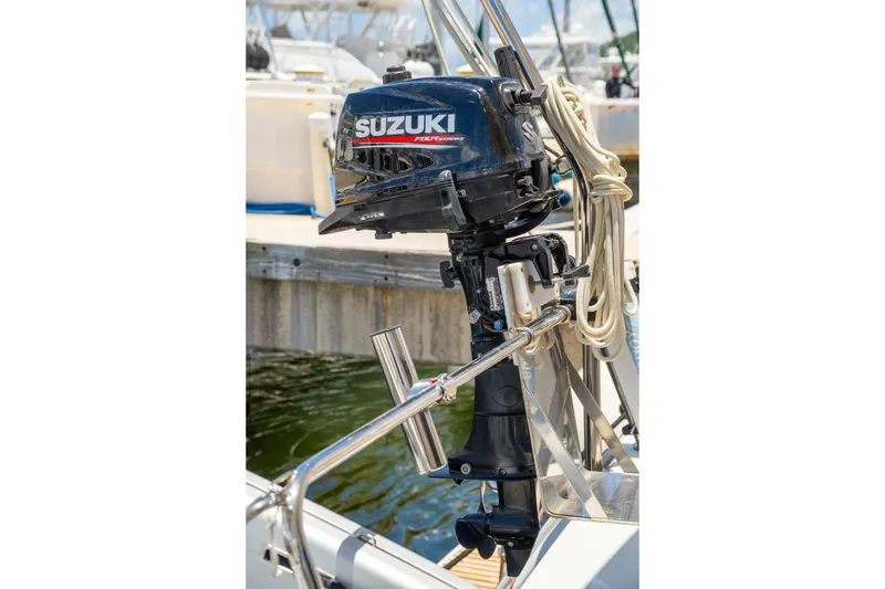 Slide: The Image of Suzuki outboard motor on a 2014 Fountaine Pajot Helia 44 catamaran at dock. - 48