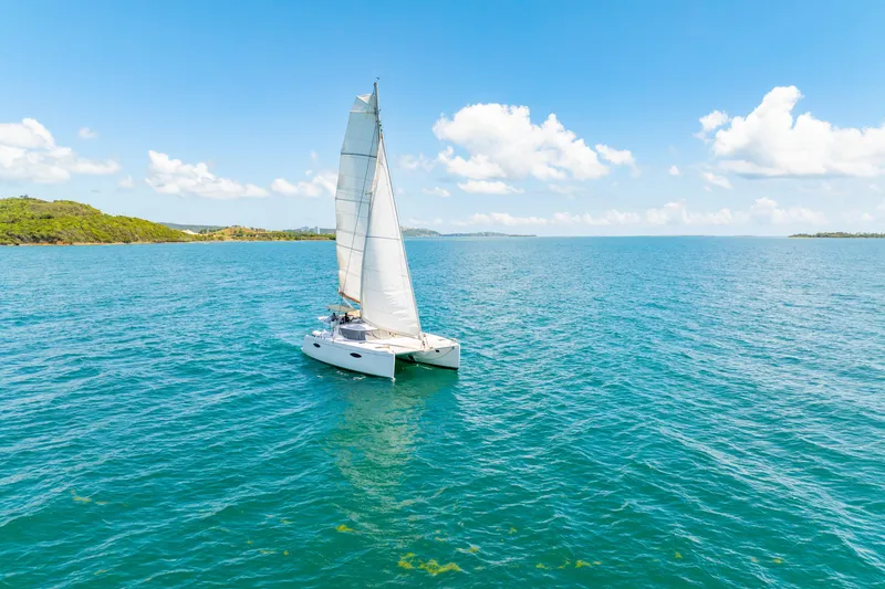 Slide: The Image of Sailing catamaran Fountaine Pajot Helia 44, 2014, gliding on clear blue ocean under sunny skies. - 50