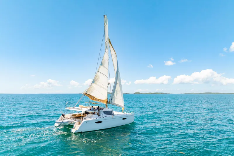 Slide: The Image of Sailing catamaran Fountaine Pajot Helia 44, 2014 model, cruising on open sea under clear skies. - 54