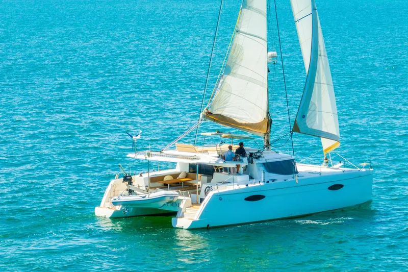 Slide: The Image of 2014 Fountaine Pajot Helia 44 catamaran sailing on clear blue waters. - 55