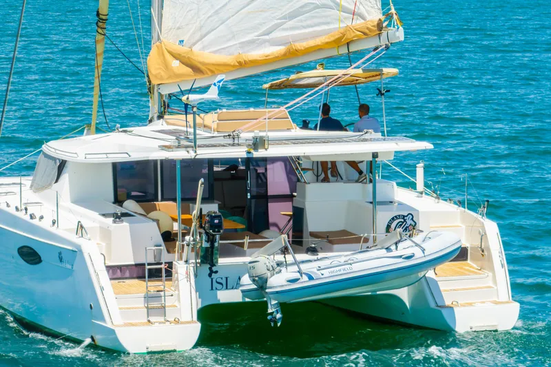 Slide: The Image of 2014 Fountaine Pajot Helia 44 catamaran sailing on blue ocean waters. - 58