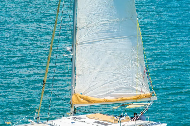 Slide: The Image of Sailing catamaran Fountaine Pajot Helia 44, 2014 model, on blue ocean waters. - 59