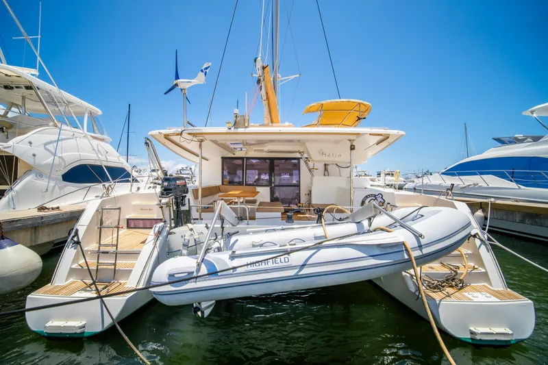 Slide: The Image of 2014 Fountaine Pajot Helia 44 catamaran docked with inflatable boat. - 6