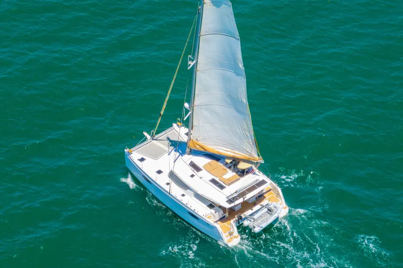 Slide: The Image of Aerial view of 2014 Fountaine Pajot Helia 44 catamaran sailing on blue ocean. - 60