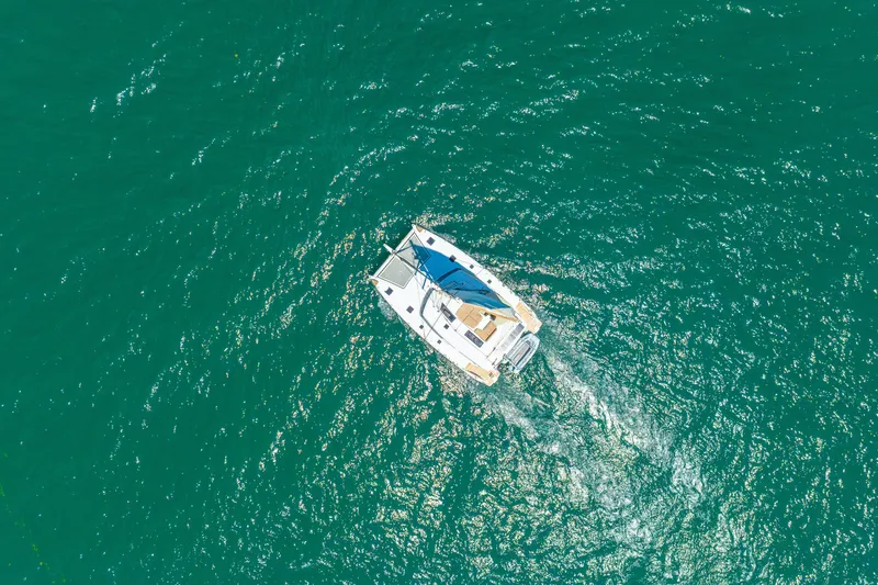 Slide: The Image of Aerial view of 2014 Fountaine Pajot Helia 44 catamaran sailing in turquoise waters. - 62
