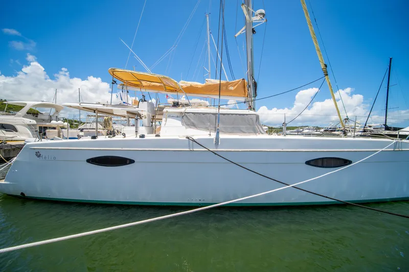 Slide: The Image of 2014 Fountaine Pajot Helia 44 catamaran docked in sunny marina. - 8