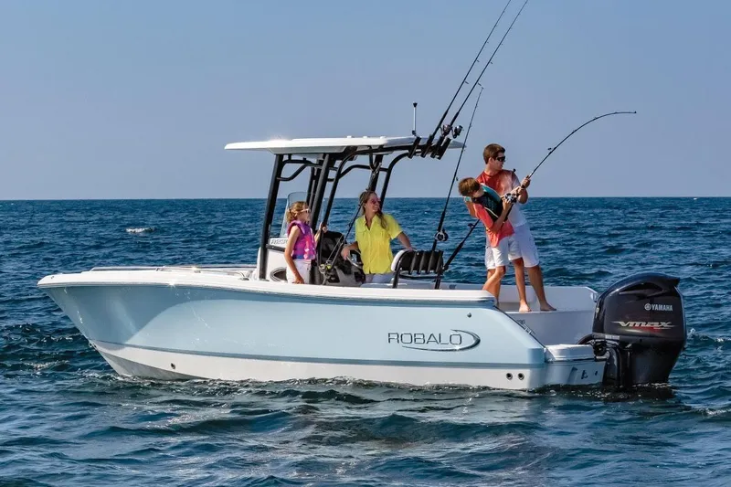 Slide: The Image of Manufacturer Provided Image: 2025 Robalo R232 Explorer boat with family fishing on open water. - 3