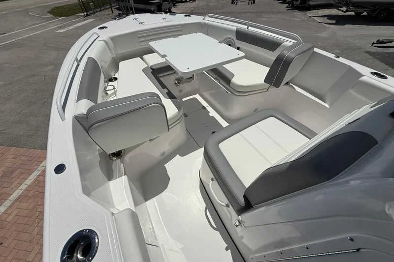 Slide: The Image of 2026 Edgewater 250CC boat interior with seating and table, showcasing modern design and comfort. - 15
