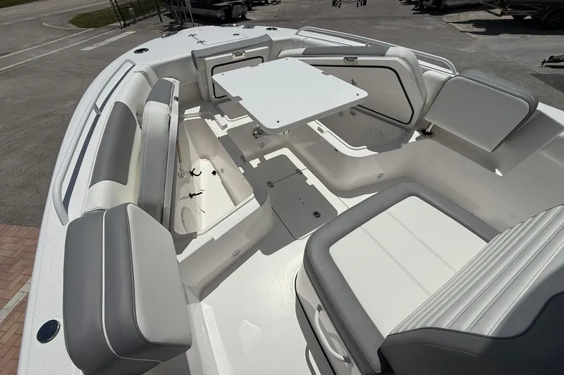 Slide: The Image of 2026 Edgewater 250CC boat interior with seating and table, showcasing modern design and functionality. - 16