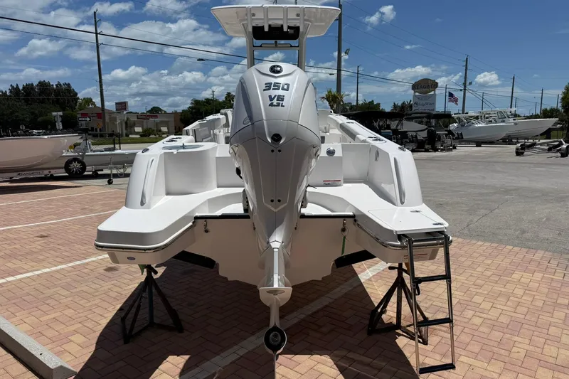 Slide: The Image of 2026 Edgewater 250CC boat with powerful 350 V8 engine, displayed outdoors on a sunny day. - 4