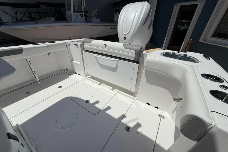 Slide: The Image of 2026 Edgewater 250CC boat interior with Yamaha engine, featuring spacious deck and seating. - 8