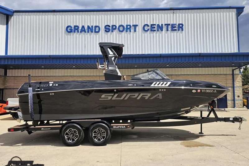 The Image of 2022 Supra SE 550 boat on trailer at Grand Sport Center. - 1
