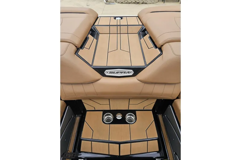 Slide: The Image of 2022 Supra SE 550 boat interior with tan upholstery and sleek design. - 108