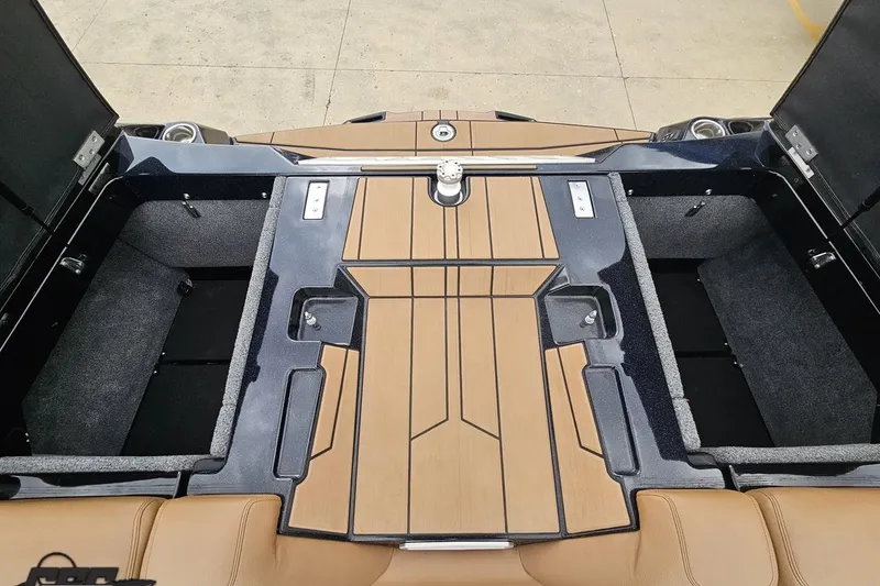 Slide: The Image of 2022 Supra SE 550 boat interior with open storage compartments and sleek design. - 111
