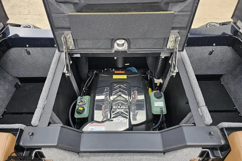 Slide: The Image of 2022 Supra SE 550 engine compartment featuring Roush Raptor motor. - 112