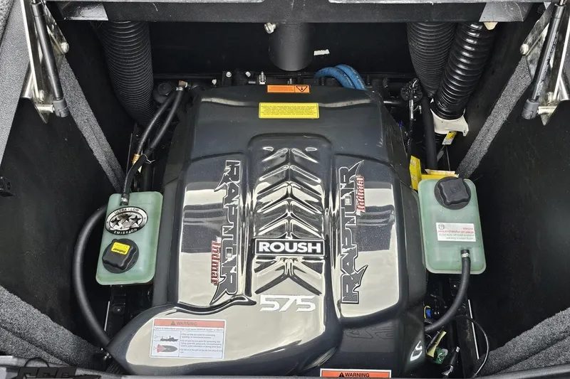 Slide: The Image of 2022 Supra SE 550 engine compartment featuring Roush Raptor 575 engine components. - 113