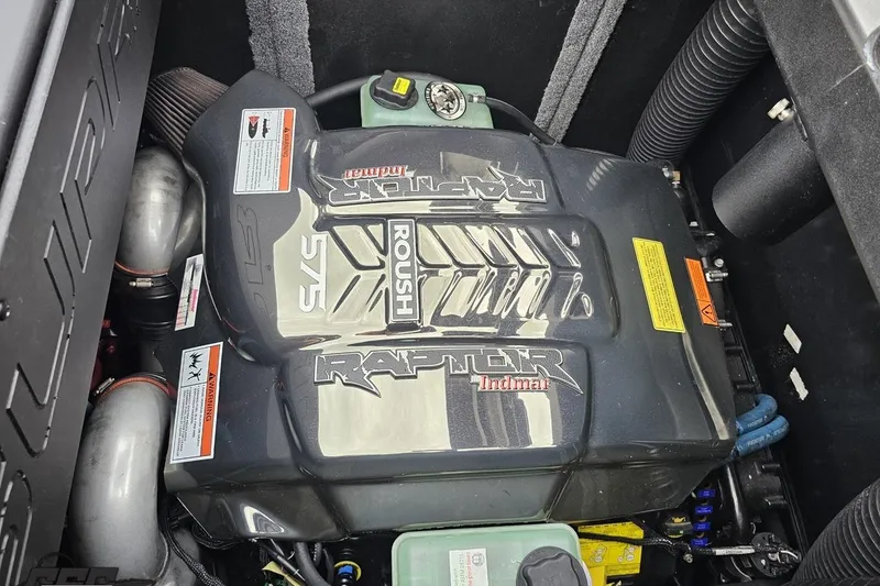 Slide: The Image of Engine compartment of a 2022 Supra SE 550 with Roush Raptor Indmar engine. - 114