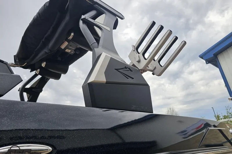 Slide: The Image of 2022 Supra SE 550 boat tower with wakeboard rack under cloudy sky. - 25