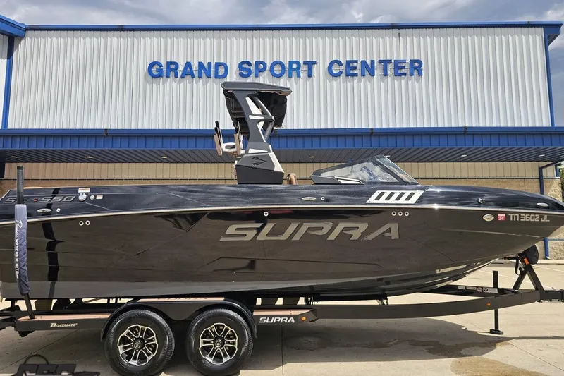 Slide: The Image of 2022 Supra SE 550 boat on trailer at Grand Sport Center. - 3