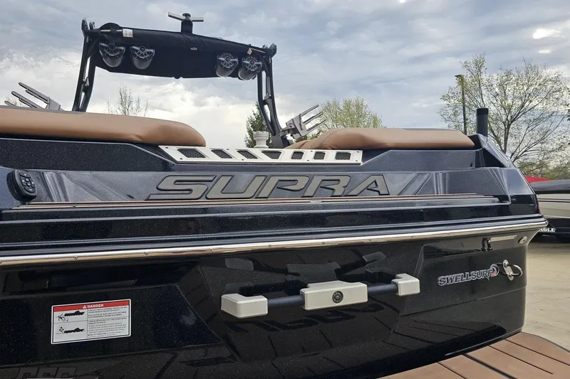 Slide: The Image of 2022 Supra SE 550 boat rear view with Swell Surf system and speakers. - 33