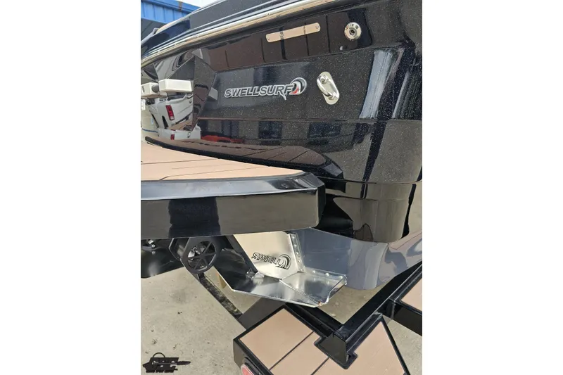 Slide: The Image of 2022 Supra SE 550 boat rear view with SwellSurf technology, showcasing sleek design and features. - 34