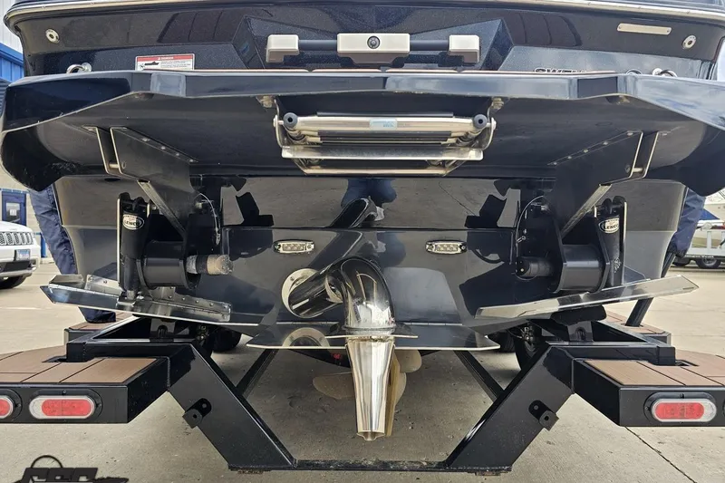 Slide: The Image of Rear view of a 2022 Supra SE 550 boat on a trailer. - 36