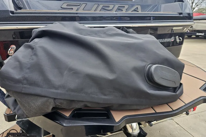 Slide: The Image of 2022 Supra SE 550 boat with covered equipment on deck. - 37