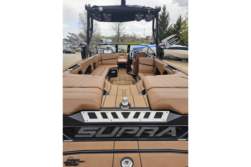 Slide: The Image of 2022 Supra SE 550 boat interior with luxurious tan seating and sleek design. - 39