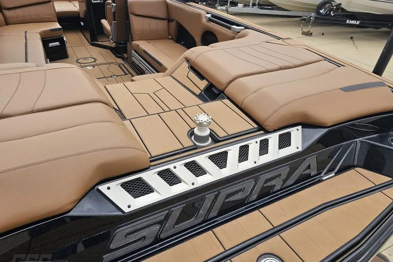 Slide: The Image of Luxurious interior of 2022 Supra SE 550 boat with tan seating and sleek design. - 41