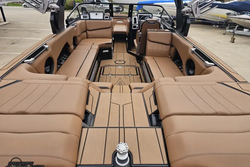 Slide: The Image of Luxurious interior of 2022 Supra SE 550 boat with tan leather seating. - 42