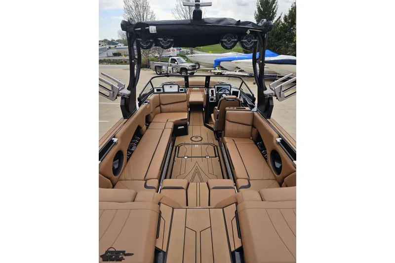 Slide: The Image of 2022 Supra SE 550 boat interior with luxurious tan seating and modern dashboard. - 44