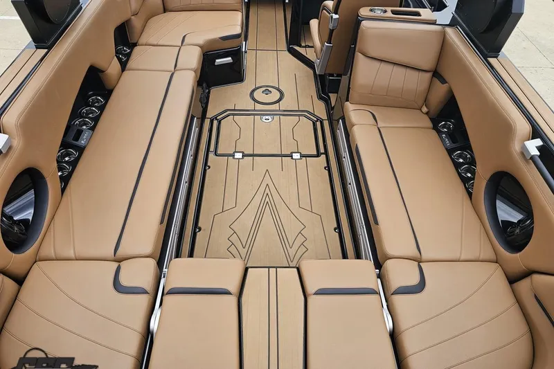 Slide: The Image of Luxurious interior of 2022 Supra SE 550 boat with tan leather seating and sleek design. - 47
