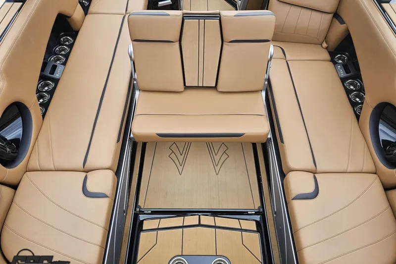 Slide: The Image of Luxurious interior of 2022 Supra SE 550 boat with tan leather seating. - 49