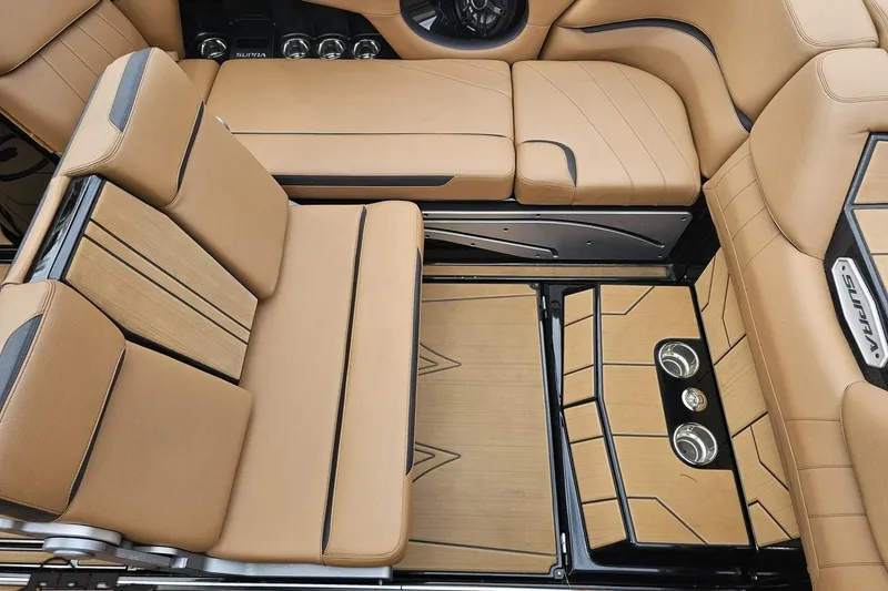 Slide: The Image of Luxurious interior of 2022 Supra SE 550 boat with tan leather seating. - 50