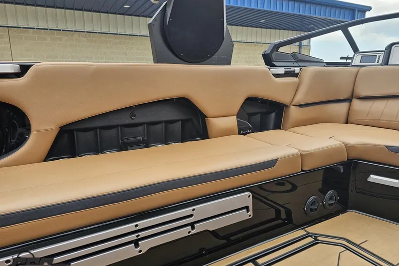 Slide: The Image of 2022 Supra SE 550 boat interior with tan leather seating and modern design. - 55