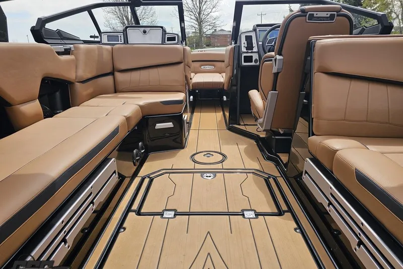 Slide: The Image of 2022 Supra SE 550 boat interior with luxurious tan seating and sleek design. - 62