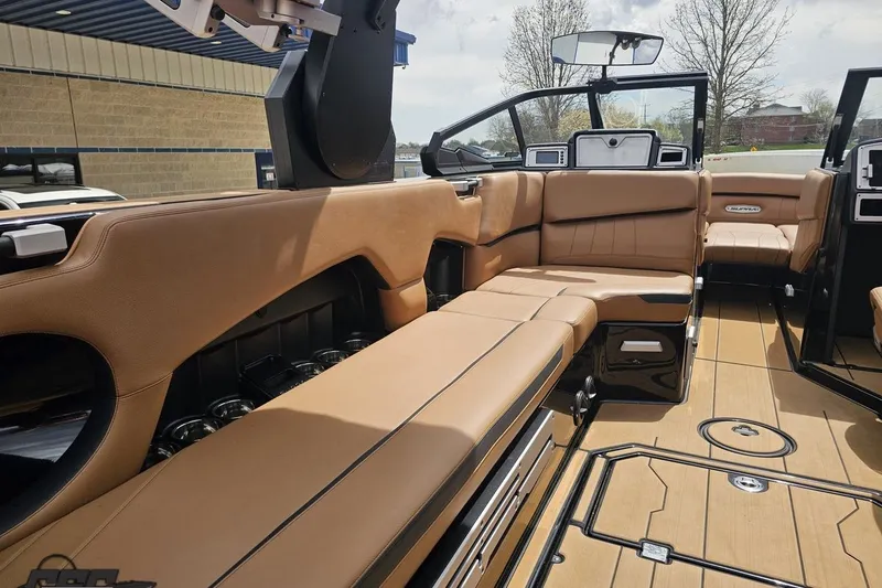 Slide: The Image of Luxurious interior of 2022 Supra SE 550 boat with tan leather seating and modern design. - 64